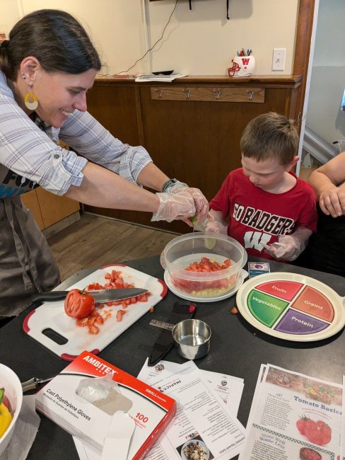 Youth and Adult making salsa